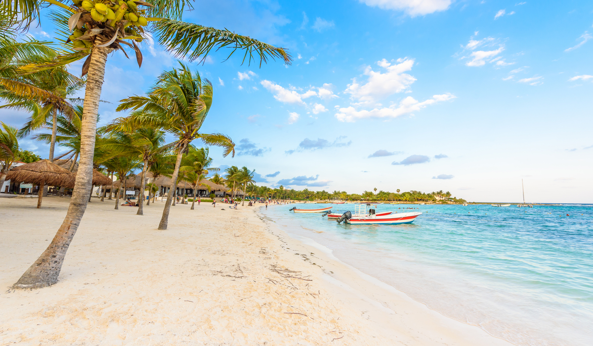 Aerial view of Playa Akumal with turquoise Caribbean water and white sand crescent
