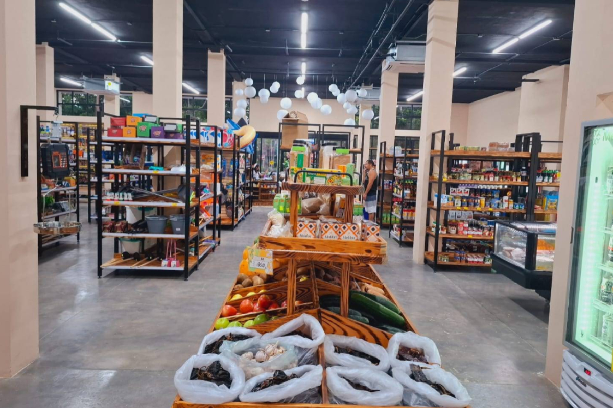 Interior of El Mercadito grocery store inside Tulum Country Club with fresh produce and pantry shelves