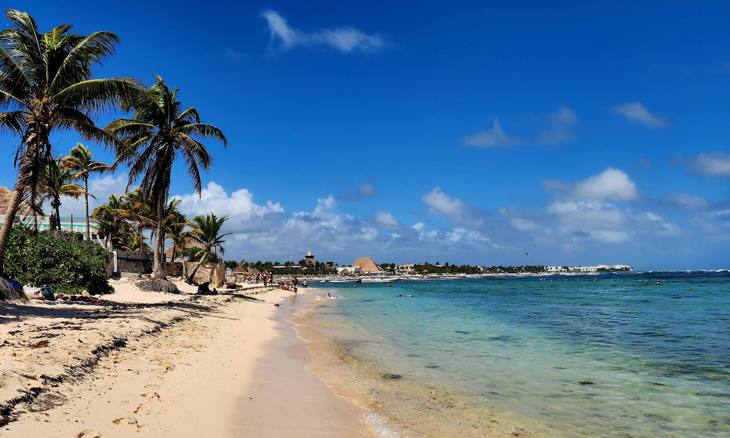 Wide white sand beach at Playa Platino inside the Santamar community