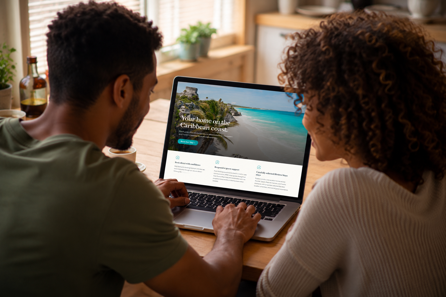 Couple browsing the PPIM Vacation Rentals website together on a laptop